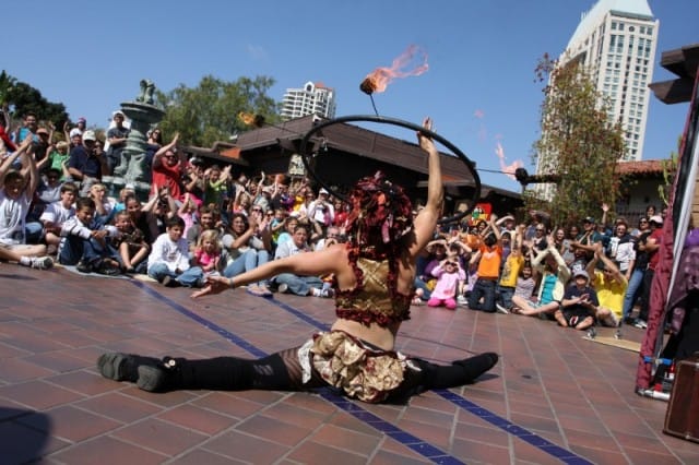 Busker doing splits with fire